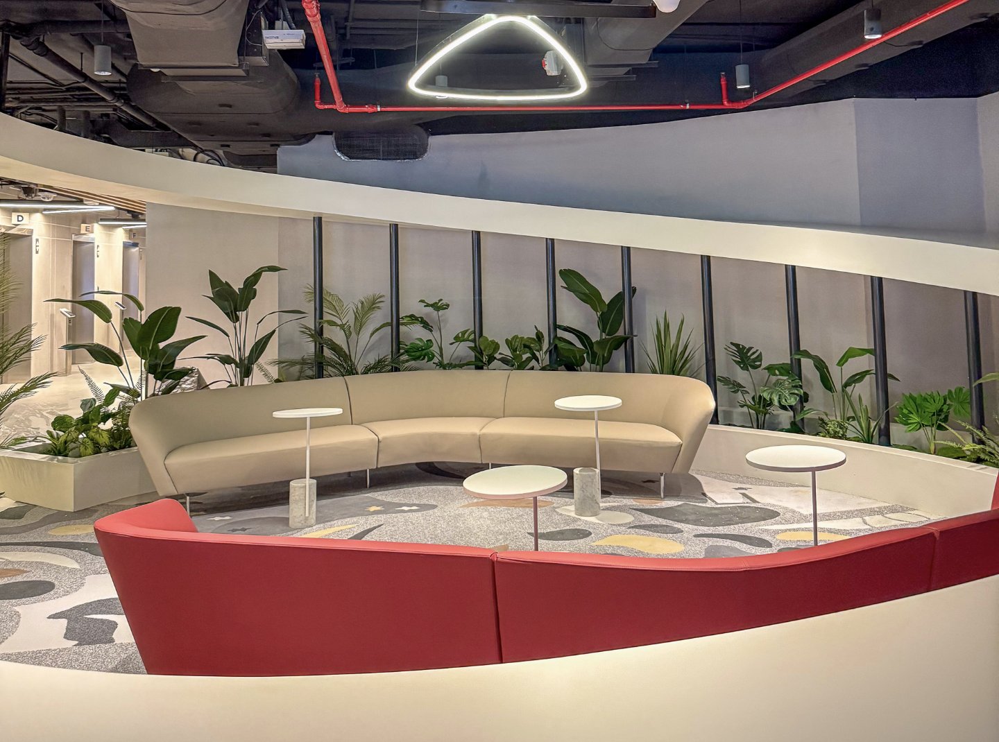 Low maintenance indoor plants around a lounge seating area in an Abu Dhabi office